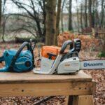 Narzędzia Makita i Husqvarna na drewnianej powierzchni